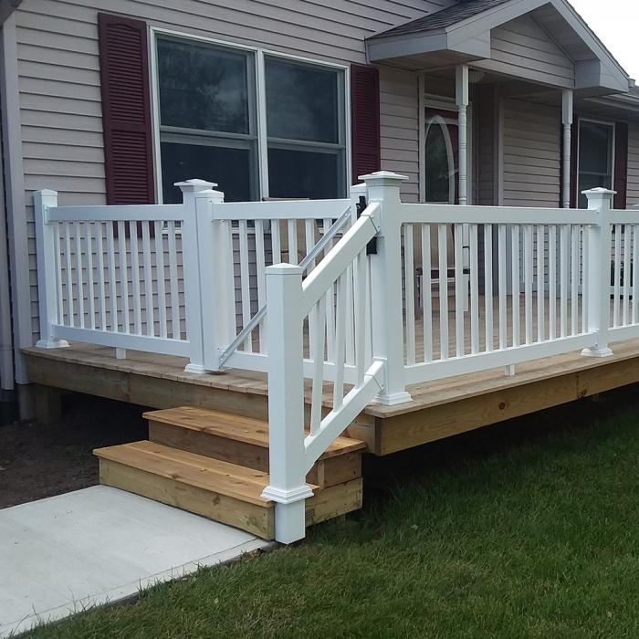Greenwich on light colored deck with stairs and gate