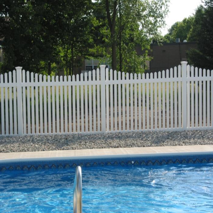 richmond picket fencing with dog ear caps around a pool