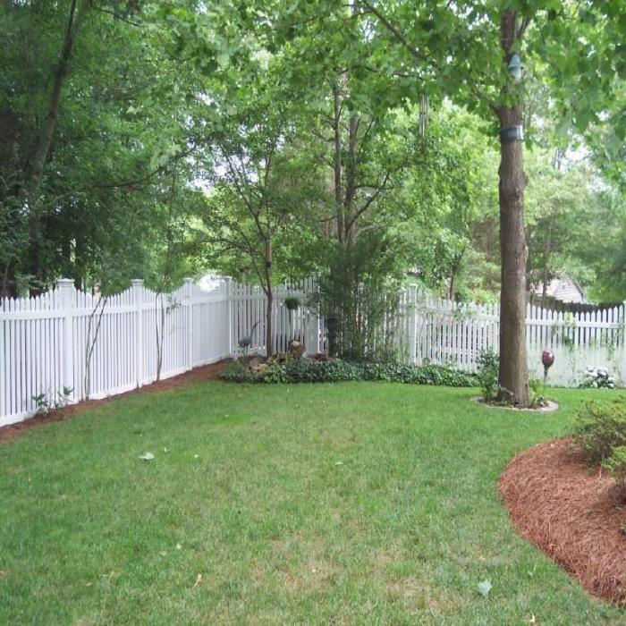 richmond white picket fencing in back yard landscaping