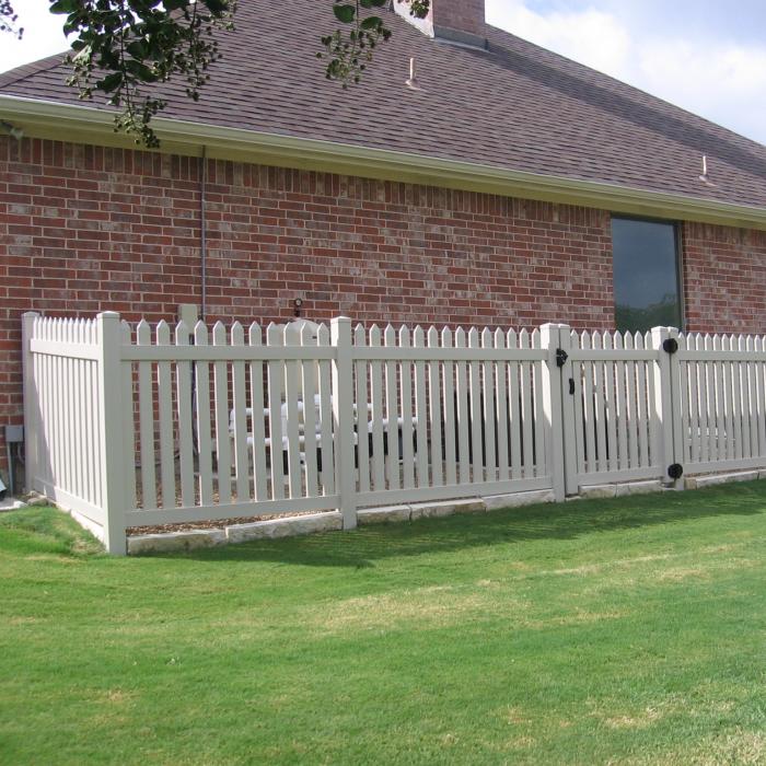 Tan Provincetown vinyl picket fence with single gate