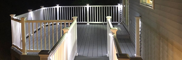 deck at night time lit by led deck railing lights